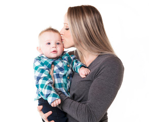 A mother with the baby boy on studio white background