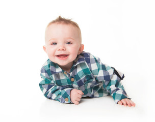 Baby boy sitting on the floor, calm and relaxed