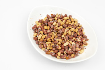 Fried Salty Peanut served in the white bowl above white background