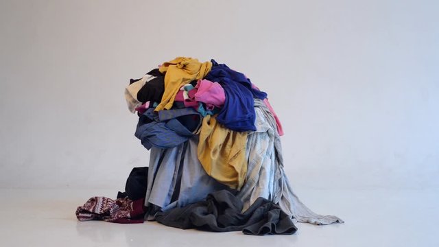 throw other clothes onto a pile of clothes. Parsing and sorting things in the wardrobe