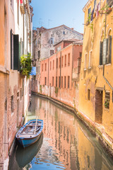 old boat in canal in Venice