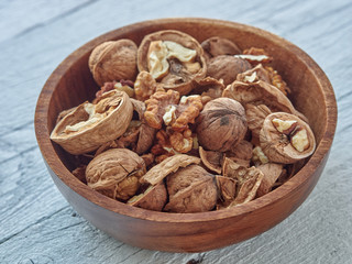 Walnuts lie on a light colored background