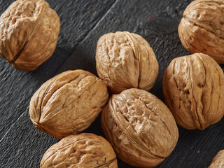 Walnuts lie on a light colored background