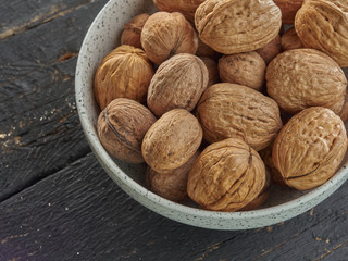 Walnuts lie on a light colored background