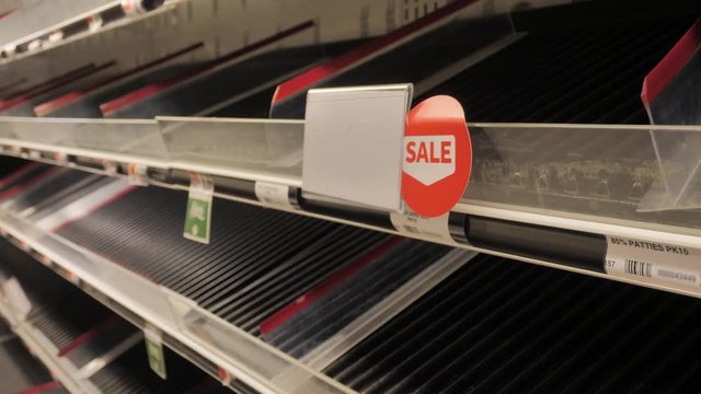 Empty shelves at supermarket during a crisis