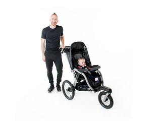 A father jogging with a baby stroller
