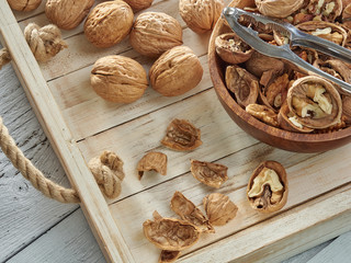 Walnuts lie on a light colored background