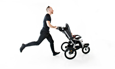 Fototapeta na wymiar A father jogging with a baby stroller