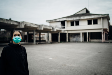 Scared devastated woman wearing a protective mask.Activities in time of epidemic/pandemic.Panic and fear of infection.Life in contaminated area.Actions for prevention and control.Nosophobia