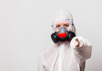 female doctor in protection suit and glasses with mask
