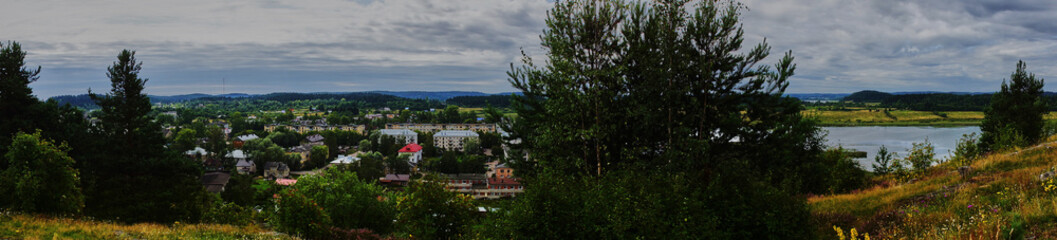 Panorama of the city from a height.Panoramic view of the city of Sortavala from a hill in a city park: a forest of conifers, traces of volcanic lava, rocks and volcanic rocks. Russia, Karelia, Sortava