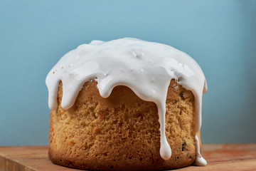 Various Spring Easter cakes with white icing and sugar decor on the table decorated in rustic style
