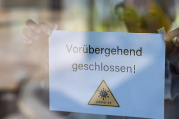 Biology and science. We're closed or postponed sticker.  Virus or bacteria cells. Global alert....