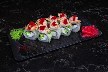 sushi with fish shrimps and so on.sushi on a black background