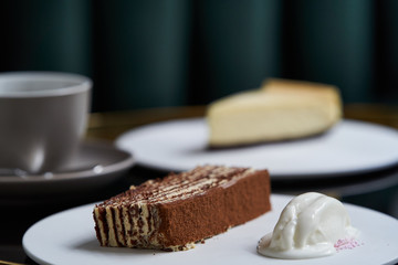 Afternoon tea with cake on restaurant table, close-up.