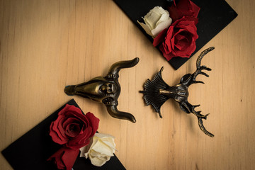 Steel animal figures with red roses