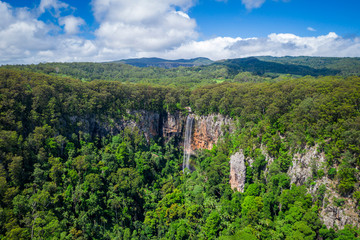 Fototapeta na wymiar Purling Brook Falls, Springbrook National Park, Queensland in full flow from drone aerial