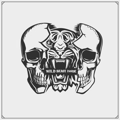 The emblem with tiger and skull for a sport team. Wild beast inside. Print design for t-shirt. 