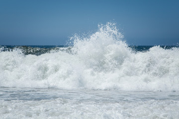 Wave Spray at Beach Coastline