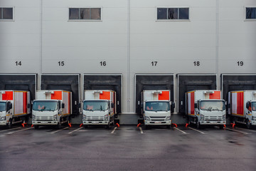 Trucks standing at loading docks for shipping from warehouse