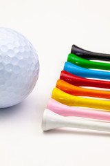 Golf set - golf ball and wooden tees.