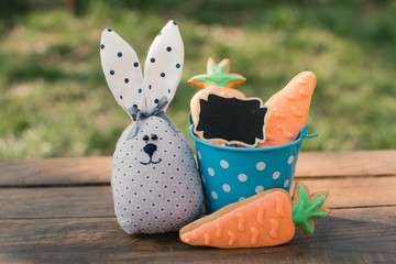 Little rabbit on the green grass background. Easter bunny. Easter holiday concept. Copy space.