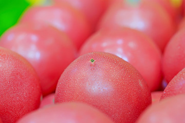 Many fresh tomatoes piled up together