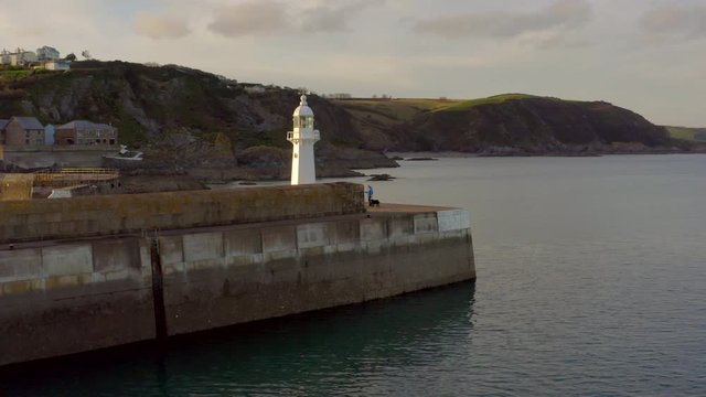 A Lighthouse on the Breakwater of Mevagissey in Cornwall UK