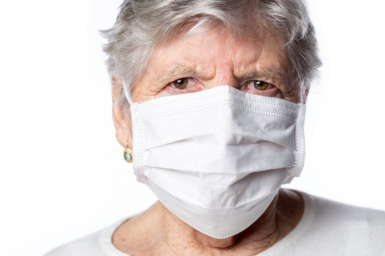 Portrait Of Senior Woman Protected Her Face By Veil During Coronavirus Pandemic. World Is Facing The Biggest Threat In Nowadays. Medical Concept.