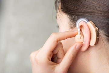 Close-up Of Hearing Aid In The Ear Of A Girl