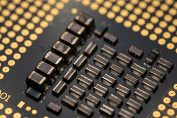 Macro photo of a CPU IC ready for insertion into a modern personal computer motherboard