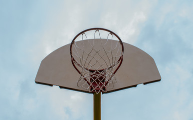 basketball hoop against blue sky