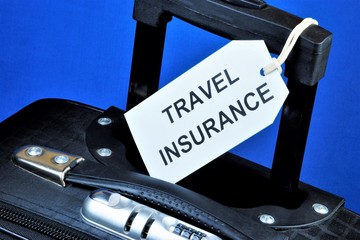 Travel insurance-text label on the background of Luggage. Travel-cultural study of countries. Insurance provides financial well-being in life situations.