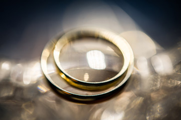Close-up view of two golden wedding rings. Wedding symbols, attributes. Holiday, celebration....