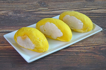 Durian cake. Delicious Thai bakery with durian fruit shaped, assorted with durian paste and salted...