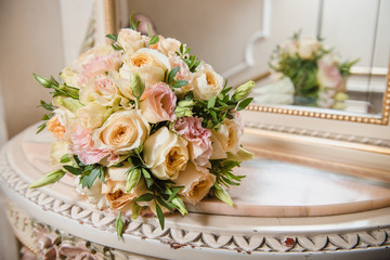 Colorful wedding bouquet on a mirror. Bridal bouquet. Luxury hotel room. Valentine's day or mother's day present