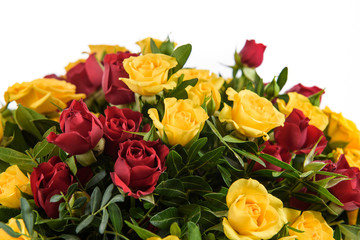 Fresh, lush bouquet of colorful flowers for present . Wedding bouquet of red and yellow roses and freesia flowers. Macro, close-up