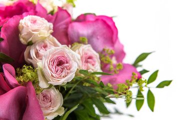 Fresh, lush bouquet of colorful flowers for present. Wedding bouquet of pink roses and freesia flowers. Macro, close-up