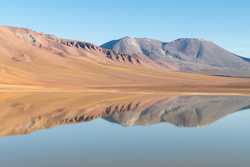 Fototapeta na wymiar Reflections in the Lejía Lake landscape, San Pedro de Atacama, Chile