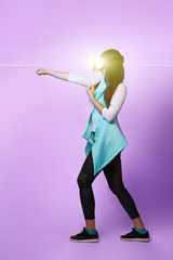 Fototapeta premium Woman is using virtual reality headset, playing game and fighting.
