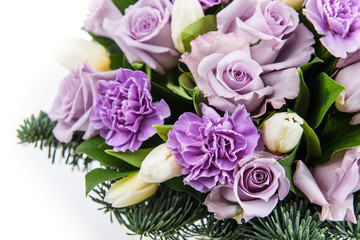 Fresh, lush bouquet of colorful flowers for present isolated on white background. Wedding winter bouquet of purple and white roses and freesia flowers. Christmas bouquet