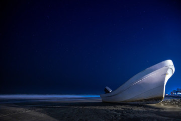 speedboat on the beach at night