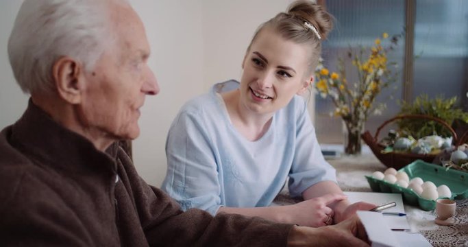 easter holiday - woman and senior man spending time together during easter holidays.