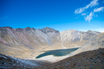 Volcano crater with a lake inside.