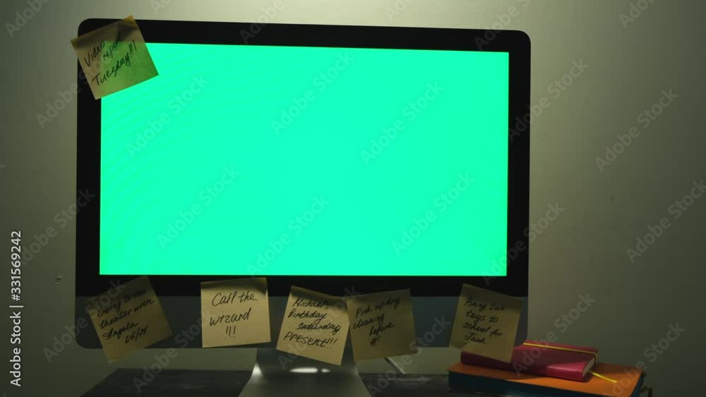 Poster stylish and creative desk with computer green screen and many sticky notes, office accessories. conc