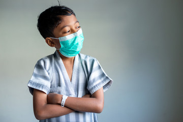 Young Muslim Boy wearing a mask. Covid-19 coronavirus concept. Shallow depth of field.