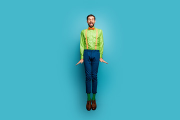 Fototapeta na wymiar Full length body size view of his he nice attractive funky cheerful cheery crazy guy jumping having fun isolated on bright vivid shine vibrant blue green teal turquoise color background