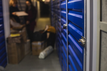 View of self storage warehouse interior, process of keeping and storing the goods and items in storage units, self-storage building, lock and key concept