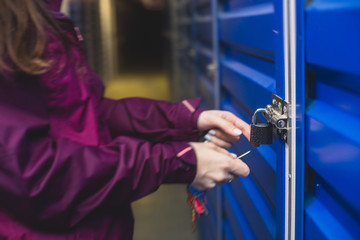 View of self storage warehouse interior, process of keeping and storing the goods and items in storage units, self-storage building, lock and key concept