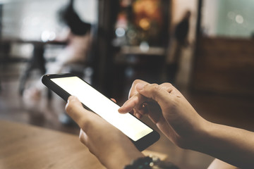 Woman hand use smartphone to do work business, social network, communication in public.